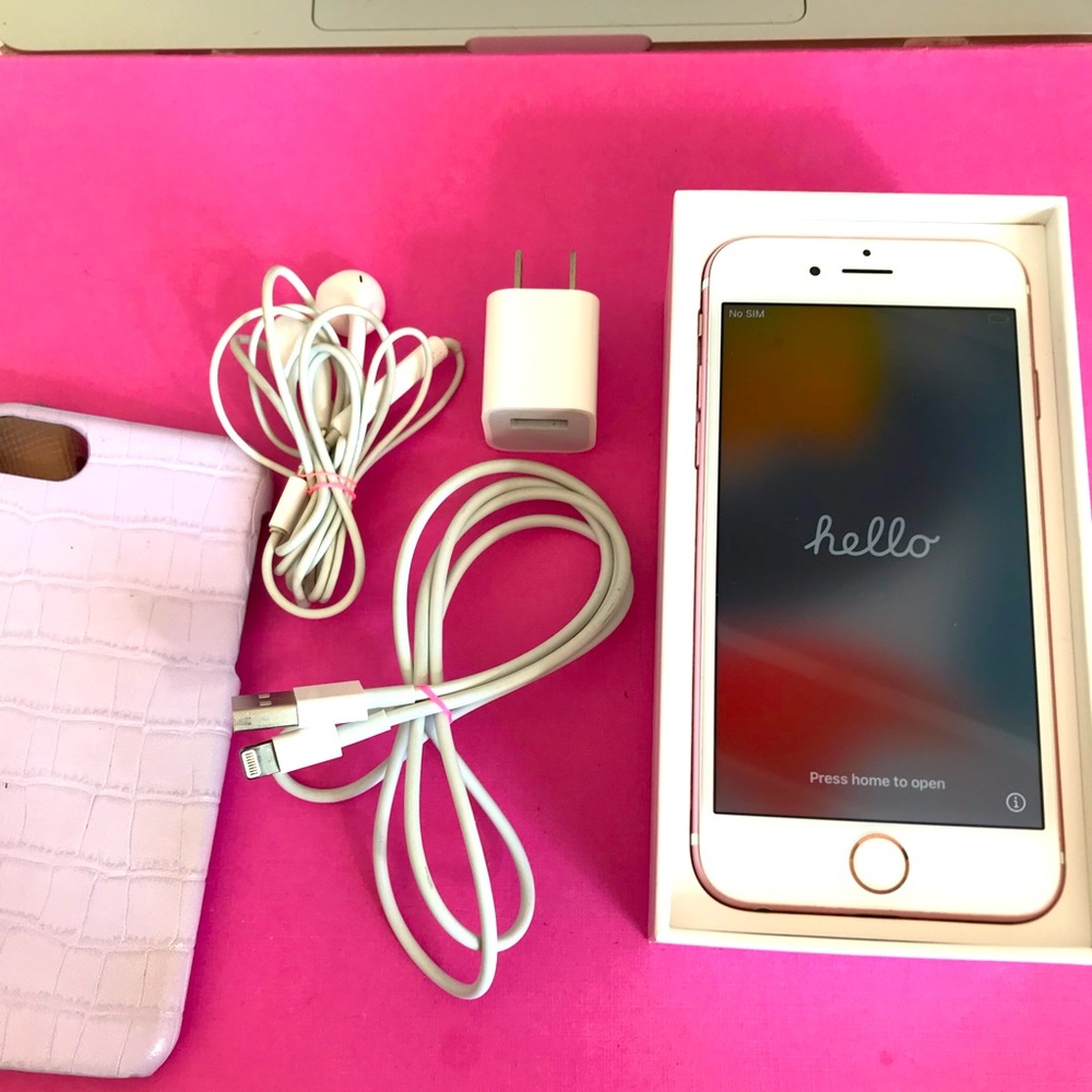 Rose Gold IPhone 6 with two cases, charger, headphones.